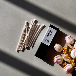 15-pack of candle wicks for use with Candle Sand, shown in a flat lay.