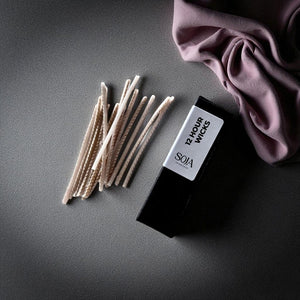 15-pack of candle wicks for use with Candle Sand, shown in a flat lay.