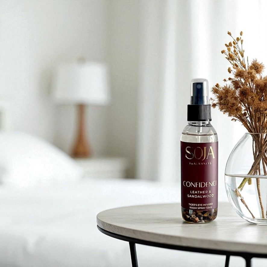 SOJA Fragrances 'Confidence' product set on a reflective surface with a neutral background