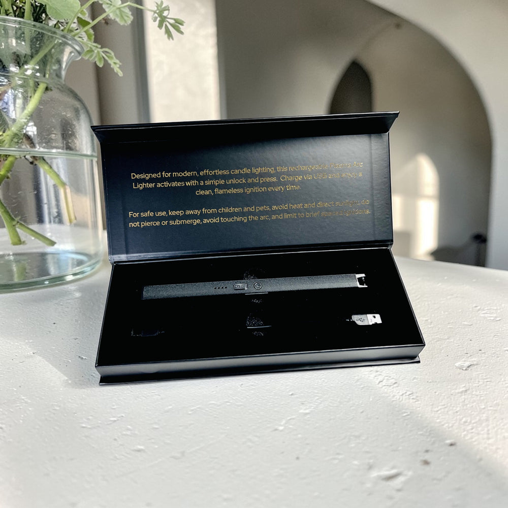 SOJA Fragrances packaging with a black rechargeable on a light surface.