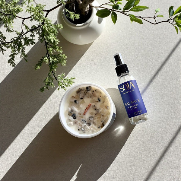 Balance candle and room spray on table showing Moonstone Crystals