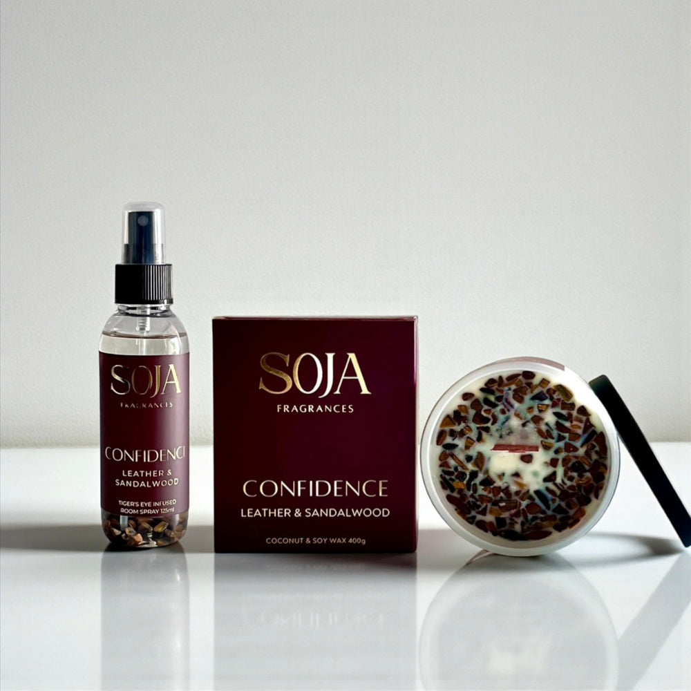 SOJA Fragrances 'Confidence' product set on a reflective surface with a neutral background