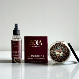 SOJA Fragrances 'Confidence' product set on a reflective surface with a neutral background