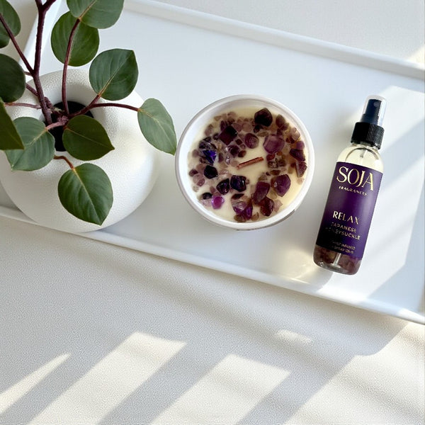 Close-up of amethyst crystals inside Relax candle