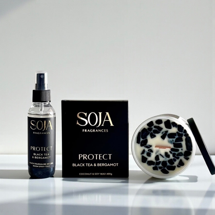 SOJA Fragrances product set including a bottle, packaging, and candle on a white surface.