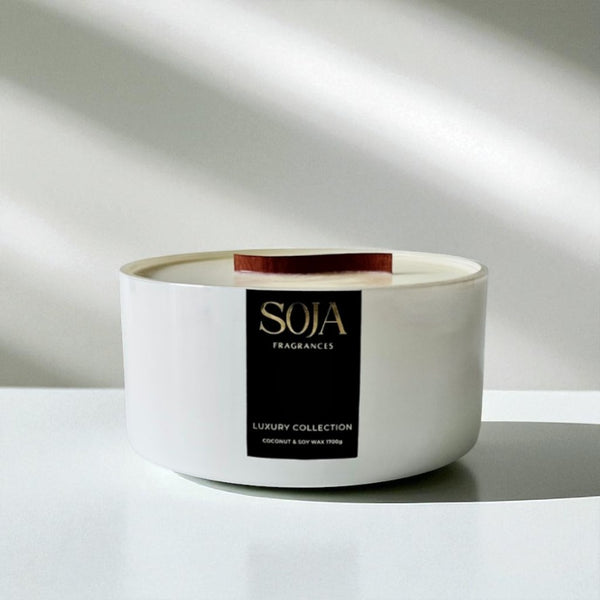 White candle with a black label on a white background