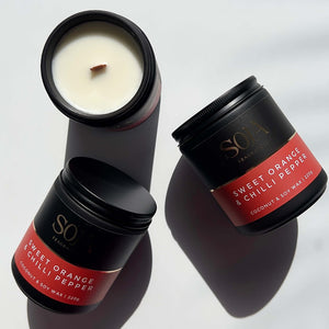 Bright and spicy home fragrance in minimalist candle jar