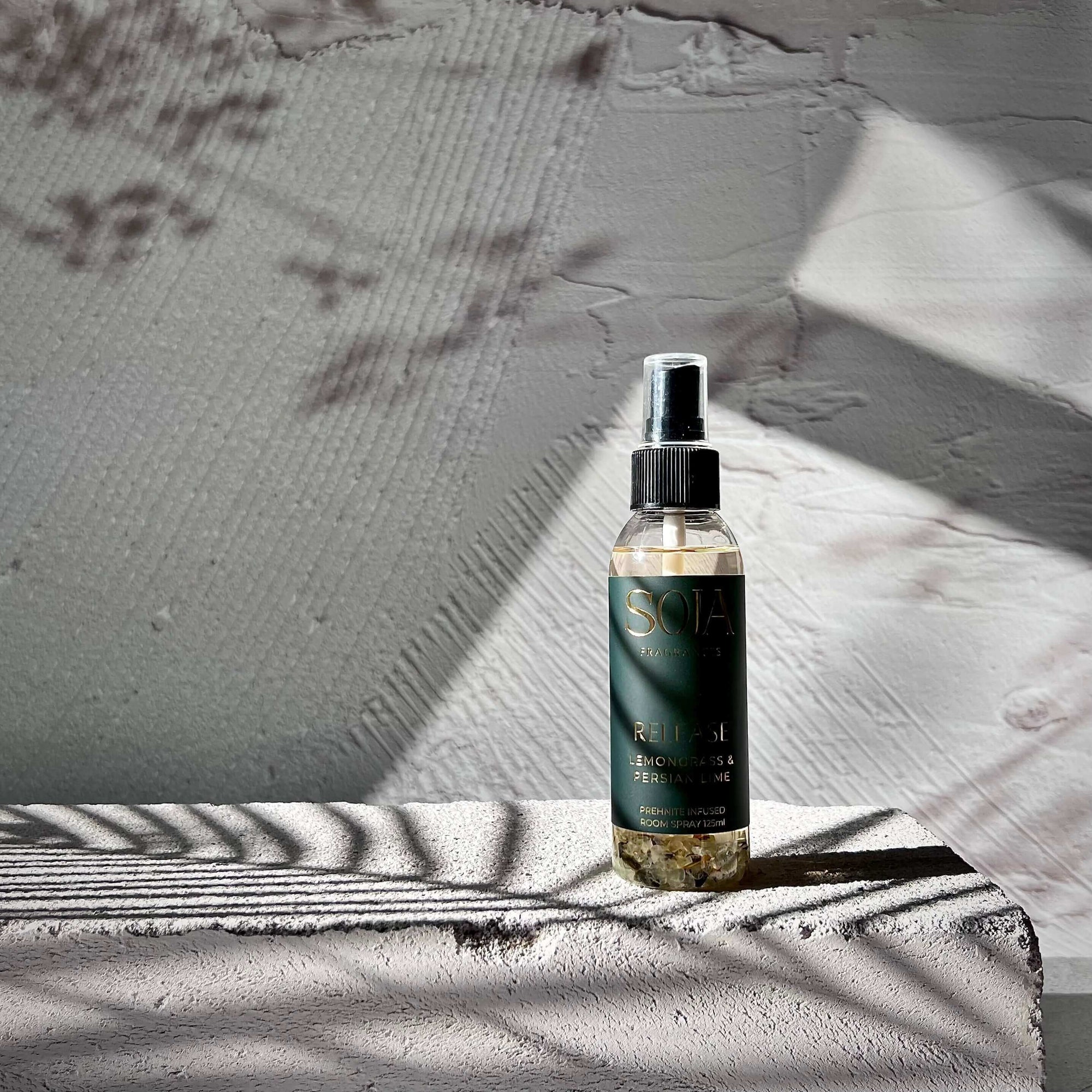 lemongrass & persian lime perfume room spray on concrete block 